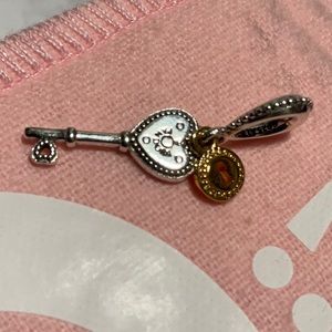 Pandora two tone key charm 14k gold and silver
